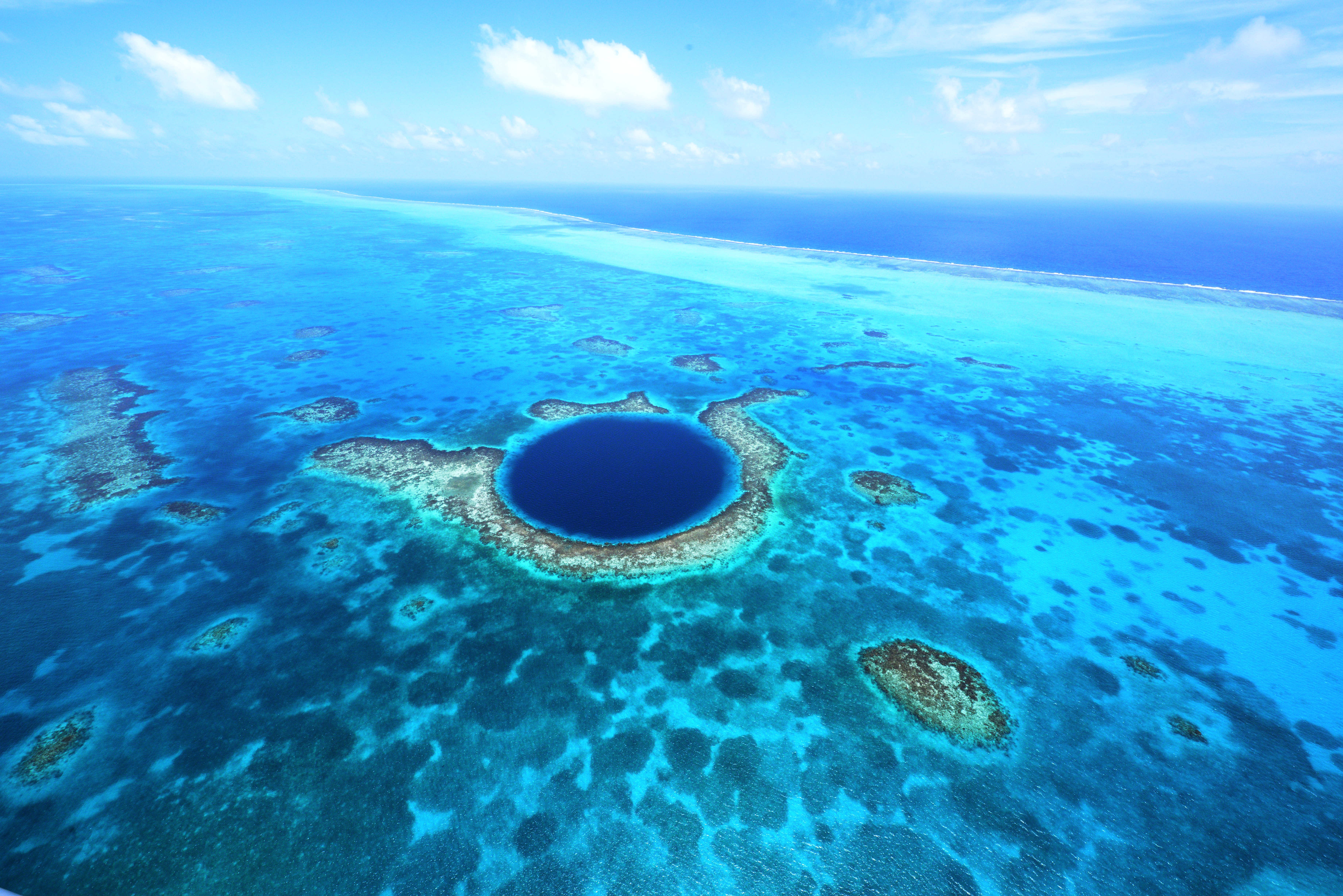 Belize Tourist Board © Aerial view of Belize's famous Great Blue Hole