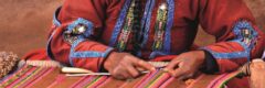 Woman doing traditional weaving at a Cusco market, Peru