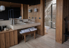 Bathroom with two sinks and shower