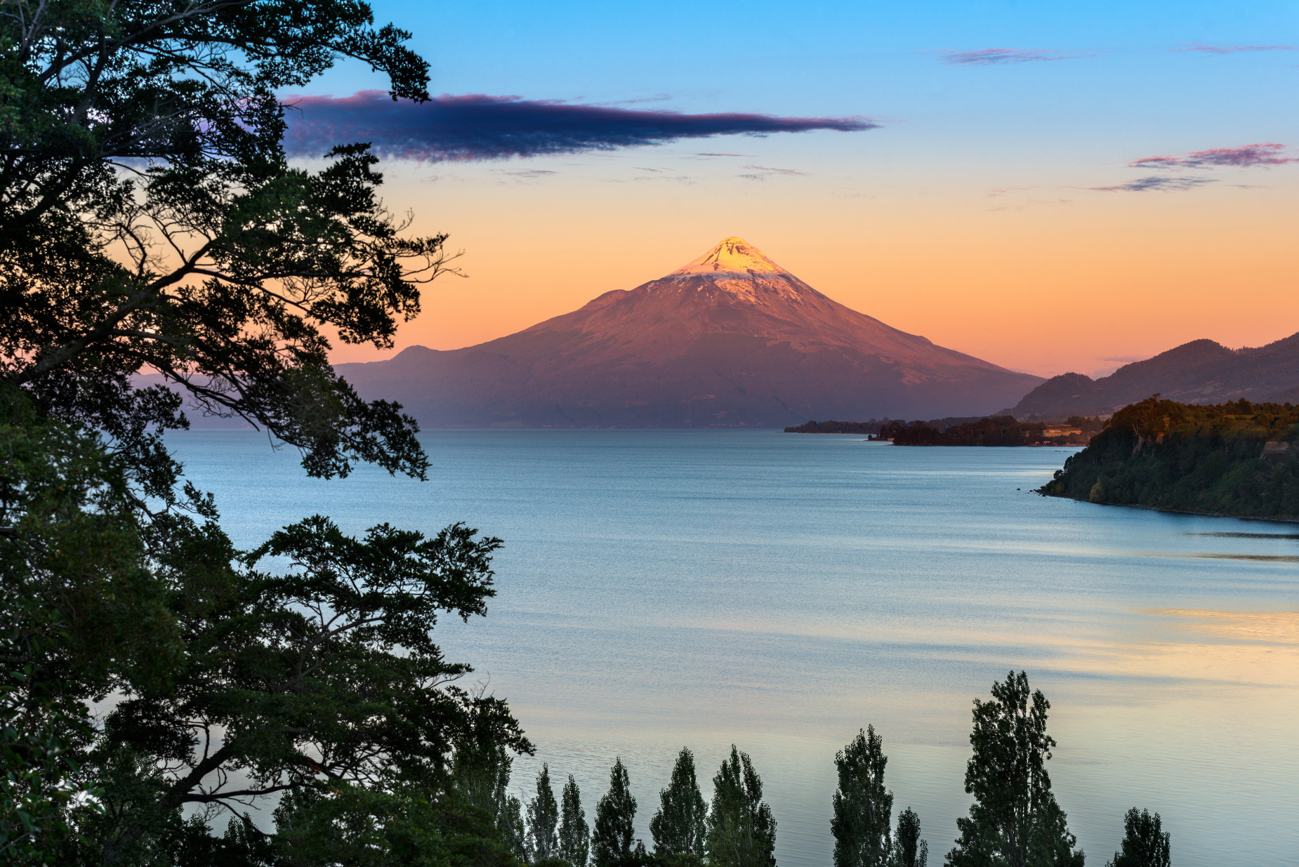 Sun setting over Osorno Lake
