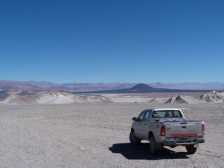 Truck driving over El Penon desert
