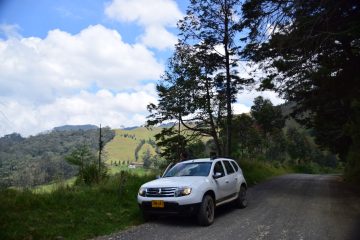 White car parked on a road in Colombia