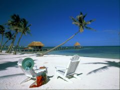 VICTORIA HOUSE  Ambergris Caye,BelizeBeach, chairs & view to jetty