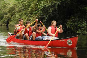 Group paddling on a river in a canoe