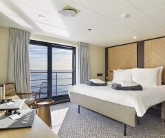 Guest room with ocean view on the Magellan Explorer Ship