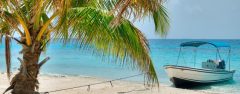 BEL_boatCayesCrop_shutterstock103306586_freewithcredit